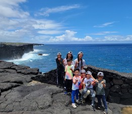 Kids learning about wave refraction on the lava cliffs and seeing firsthand how sea caves are formed while gazing upon the black noddy seabirds nesting on the cliffs. Kids Learning About Wave Refraction